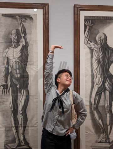  Adrien Gau poses in the likeness of two Vesalius anatomical artworks